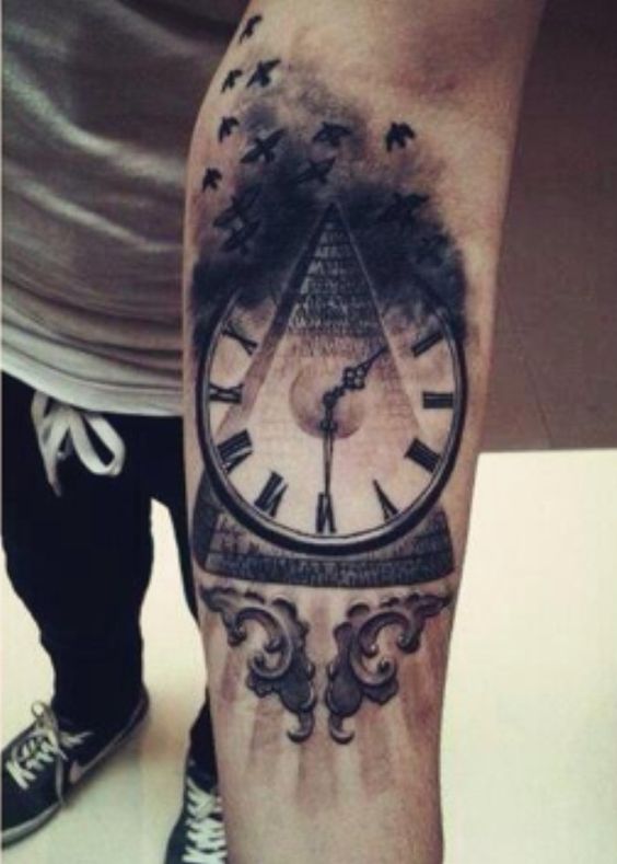 Black Ink Pyramid Clock Tattoo On Forearm