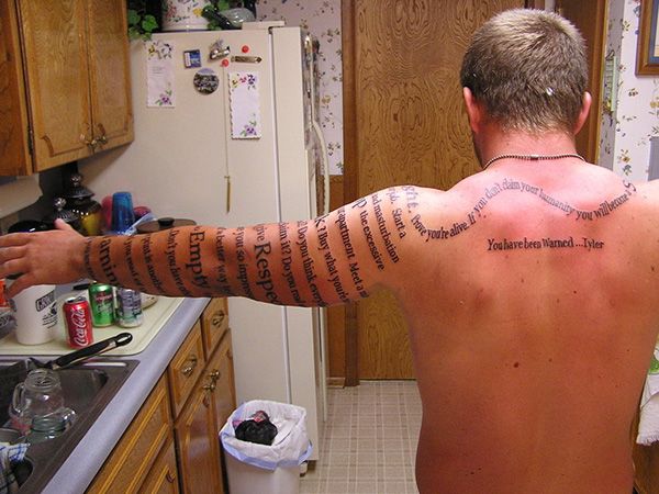 Black Literary Tattoo On Man Left Full Sleeve