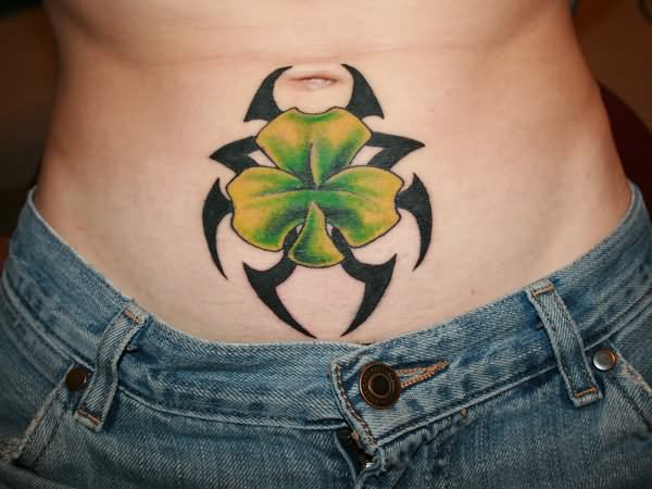 Black Tribal And Four Leaf Irish Tattoo On Stomach