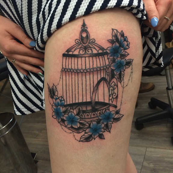 Cage With Flowers Tattoo On Girl Upper Leg