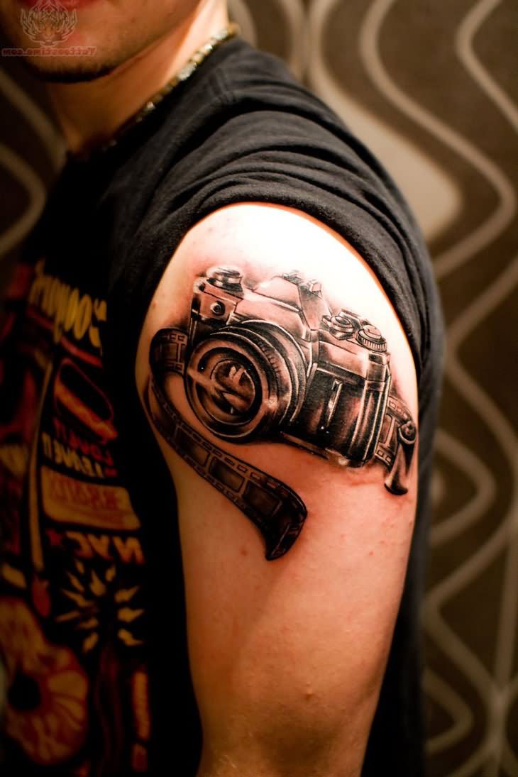 Camera And Film Strip Cinema Tattoo On Left Shoulder