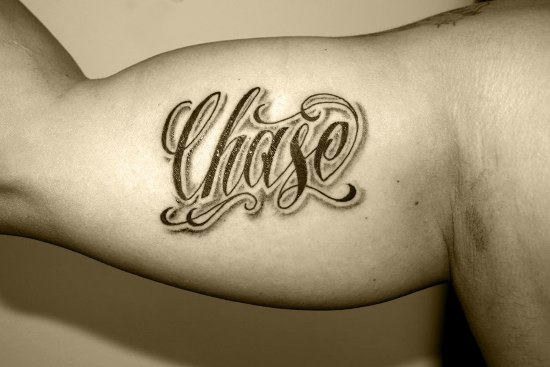 Chase Word Tattoo On Man Left Bicep