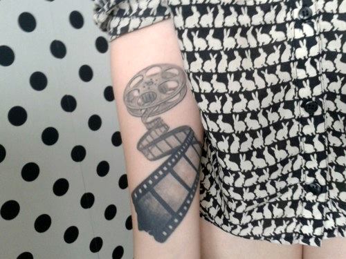 Cinema Tattoo On Girl Right Arm