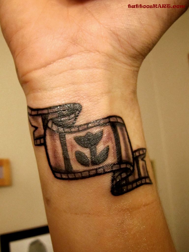 Cinema Tattoo On Right Wrist