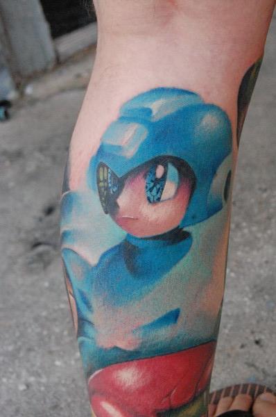 Color Ink Video Game Tattoo On Back Leg