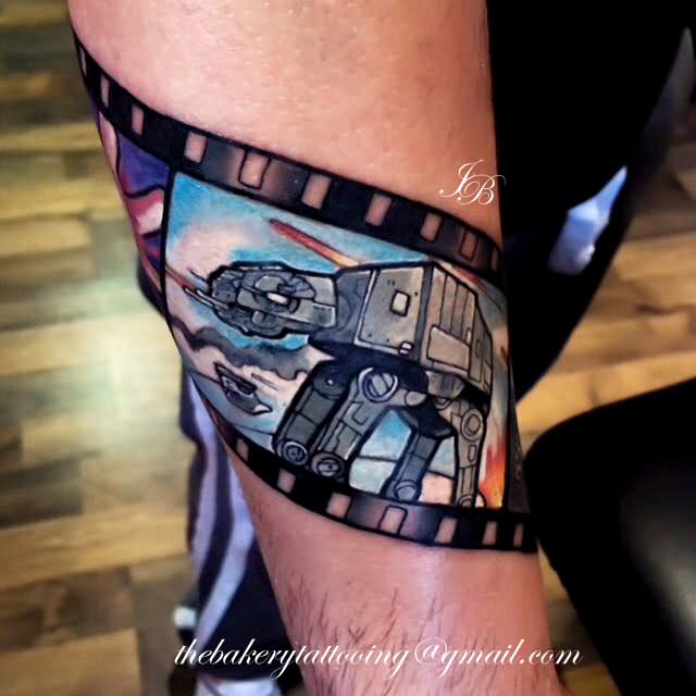 Colored Cinema Tattoo On Right Arm