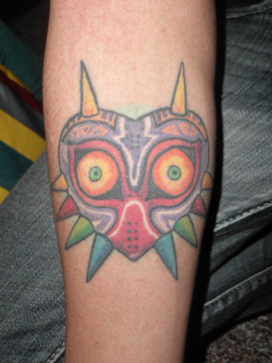 Colored Owl Video Game Tattoo On Left Arm
