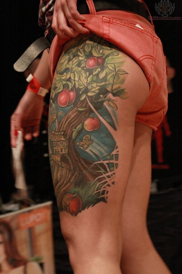 Colorful Apple Tree Tattoo On Girl Left Upper Leg