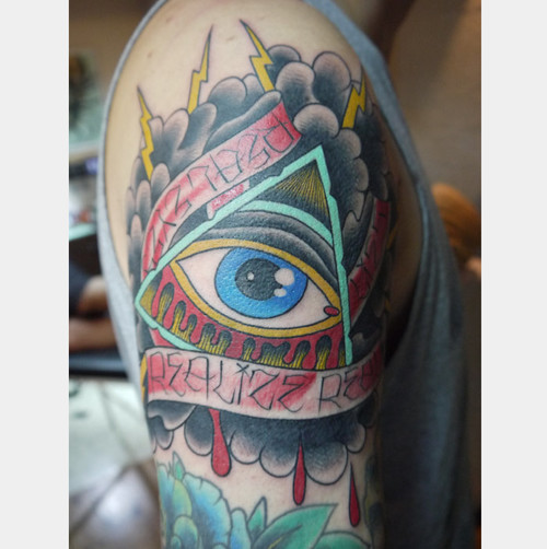Colorful Eye In Pyramid With Banner Tattoo On Man Right Shoulder