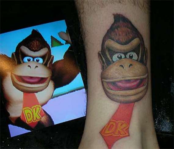 Dk Monkey Head Video Game Tattoo On Leg