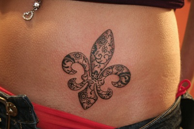 Fleur De Lis Tattoo On Girl Left Hip