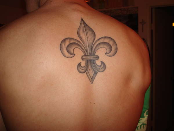 Fleur De Lis Tattoo On Man Upper Back