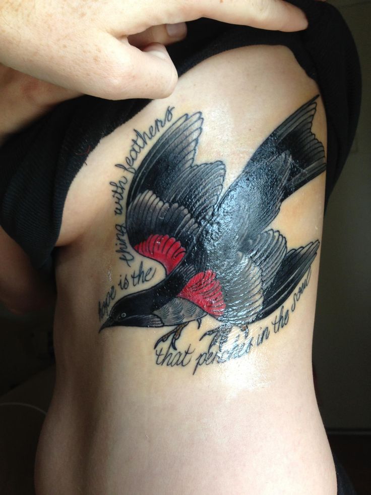Flying Bird With Literary Tattoo On Side Rib