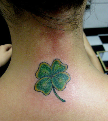 Four Leaf Irish Tattoo On Girl Back Neck