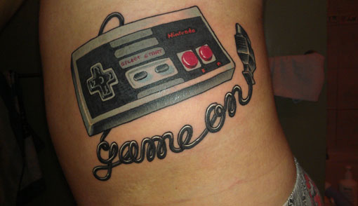 Game On Video Game Remote Control Tattoo On Side Rib