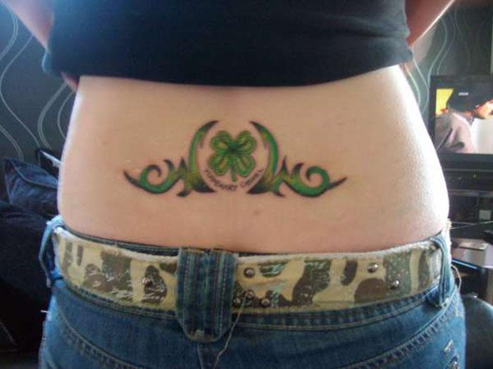 Green Irish Tribal Tattoo On Lower Back
