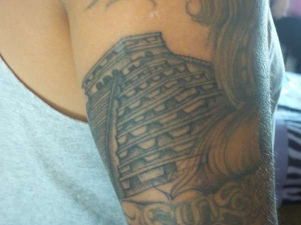Grey Ink Egyptian Tattoo On Bicep For Men