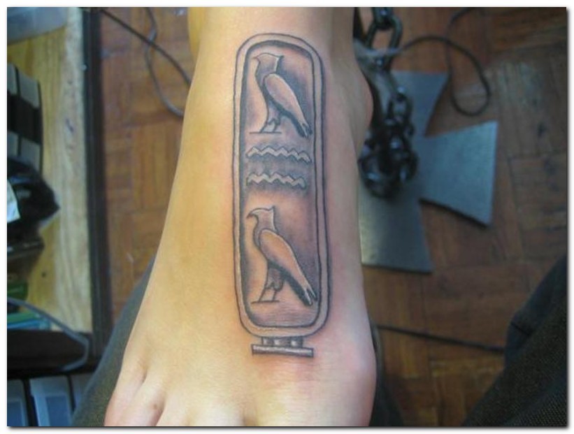 Grey Ink Egyptian Tattoo On Right Foot