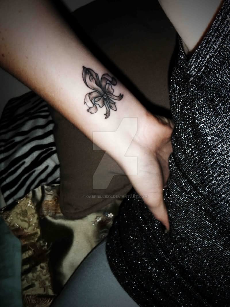 Grey Ink Fleur De Lis Tattoo On Wrist For Girls