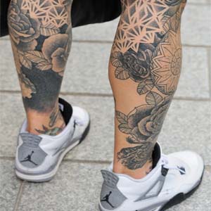 Grey Ink Flowers Tattoo On Both Leg Calf