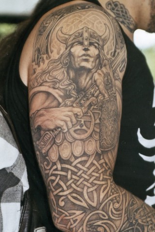 Grey Ink Irish Tattoo On Right Sleeve