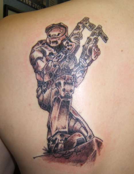Grey Ink Video Game Tattoo On Left Back Shoulder