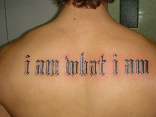 I Am What I Am Words Tattoo On Man Upper Back