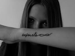Infinite Word Tattoo On Girl Left Forearm