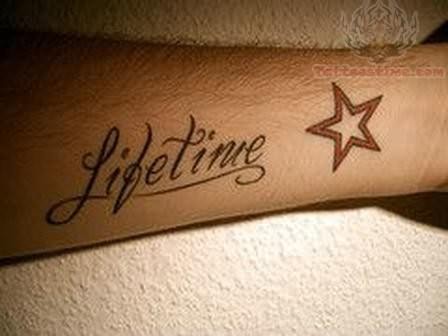 Lifetime Word With Star Tattoo On Forearm