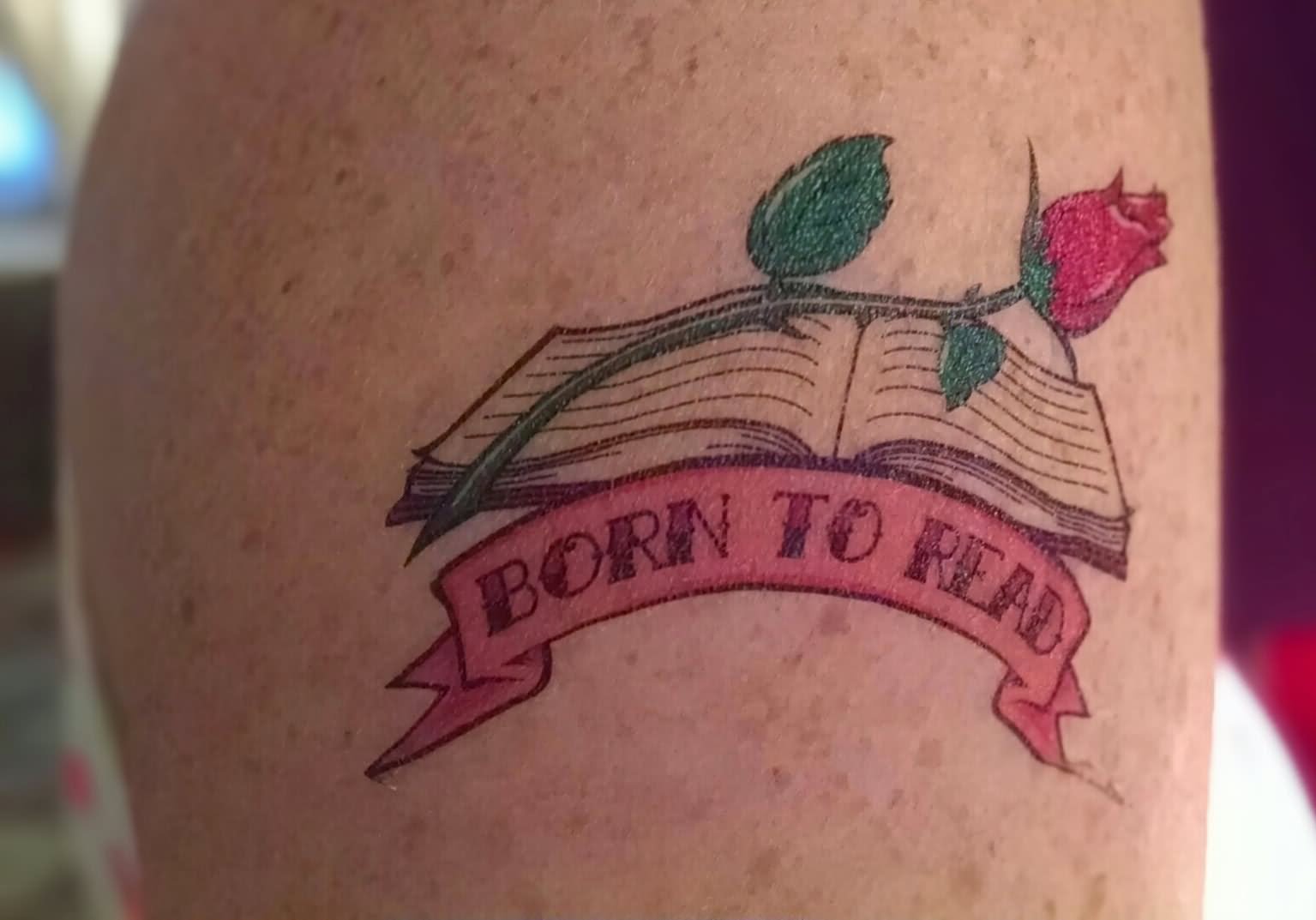 Literary Book With Rose And Banner Tattoo Design