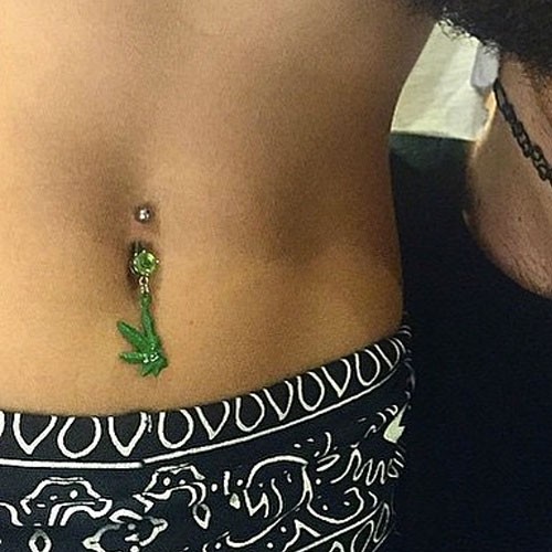 Miley Cyrus With Green Marijuana Leaf Jewelry Belly Piercing