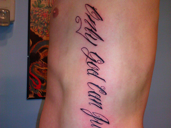 Only God Can Judge Words Tattoo On Man Side Rib
