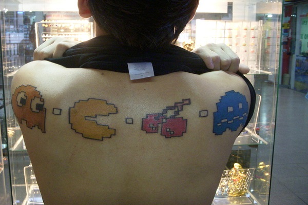 Pacman Video Game Tattoo On Upper Back