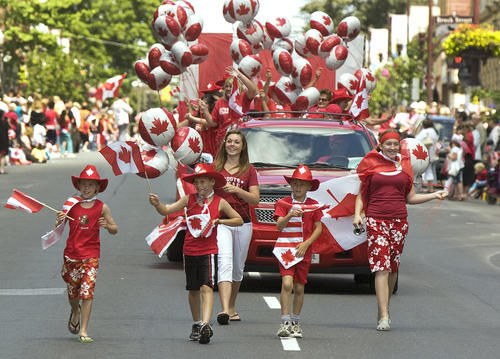 People Taking Part In Canada Day Parade
