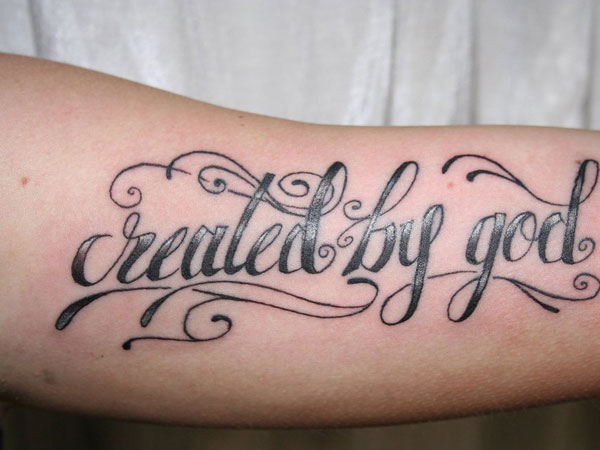 Realed By God Tattoo On Forearm