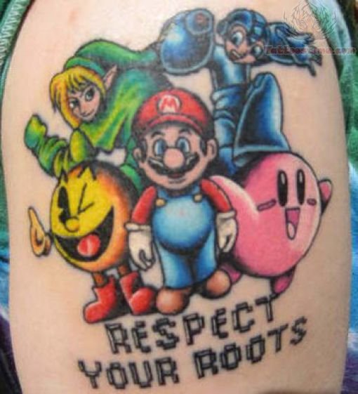 Respect Your Roots Video Game Tattoo On Left Shoulder