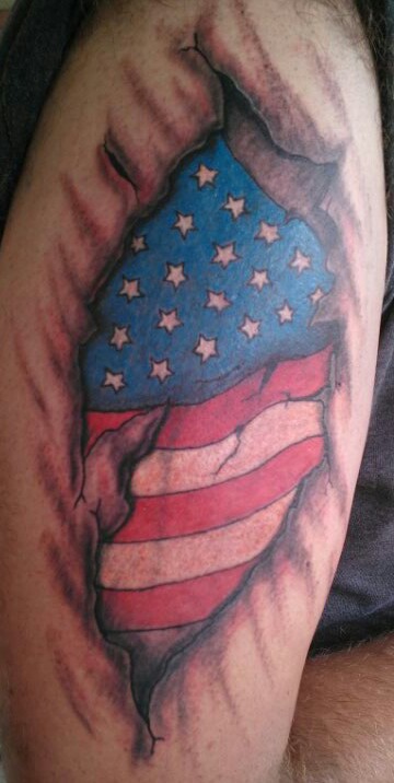 Ripped Skin American International Flag Tattoo.