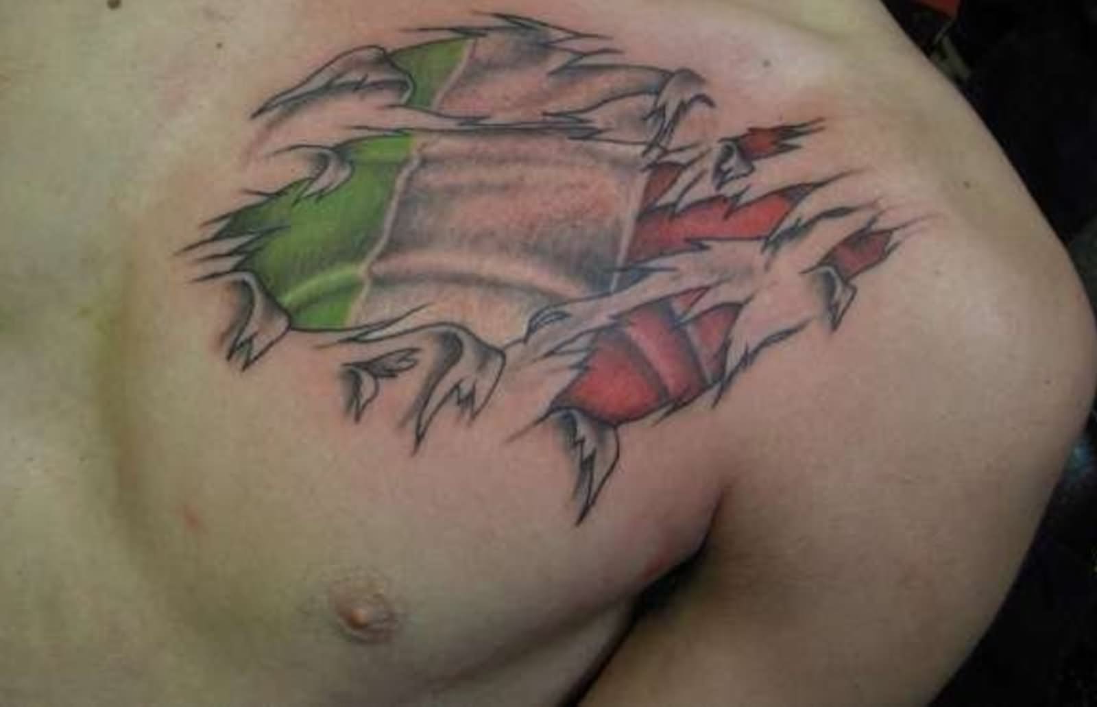 Ripped Skin Irish Flag Tattoo On Front Shoulder