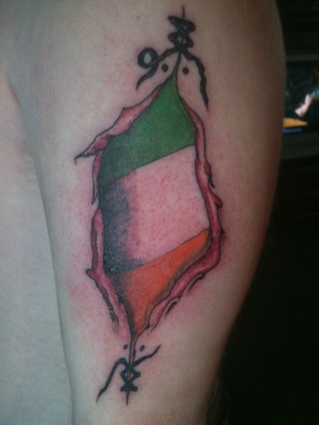 Ripped Skin Irish Flag Tattoo On Left Bicep