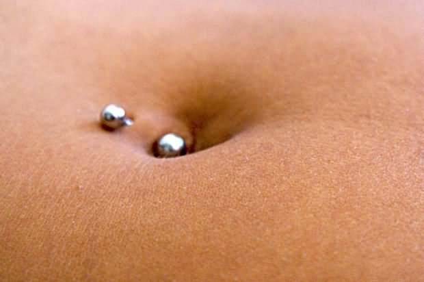 Silver Barbell Belly Piercing Closeup Image