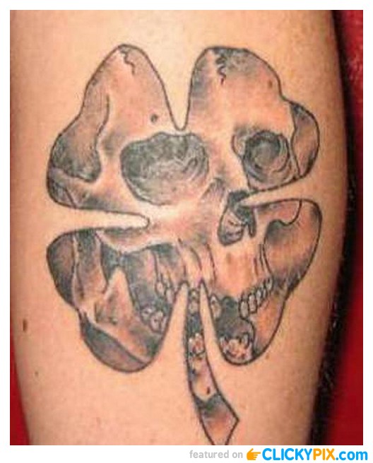 Skull In Irish Leaf Tattoo On Leg