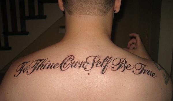 To Thine Own Self Be True Words Tattoo On Man Upper Back