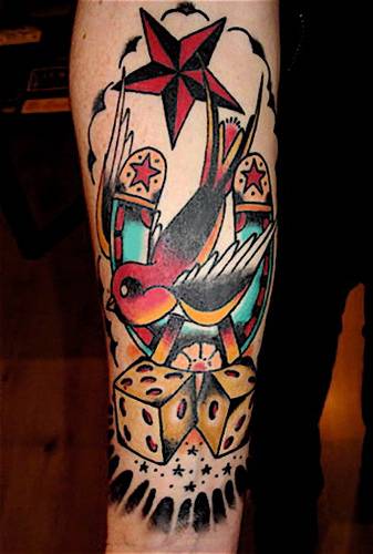 Traditional Flying Bird With Horse Shoe And Dice Tattoo On Leg