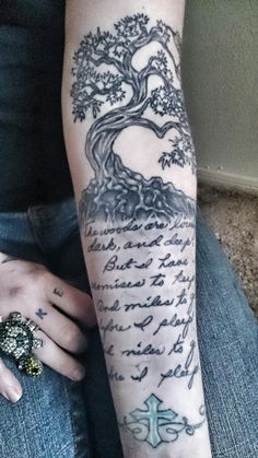 Tree With Literary Tattoo On Left Sleeve