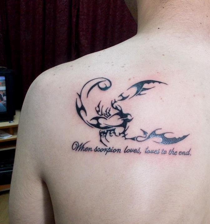 Tribal Scorpion With Words Tattoo On Left Back Shoulder