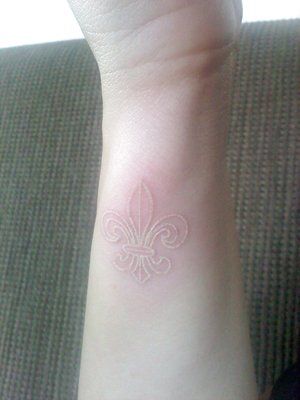 White Ink Fleur De Lis Tattoo On Side Wrist