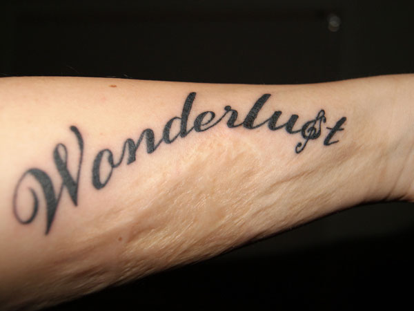 Wonderlust Word Tattoo Design For Men Forearm
