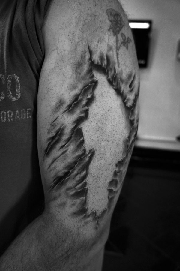 3D Torn Ripped Skin Tattoo On Man Left Half Sleeve