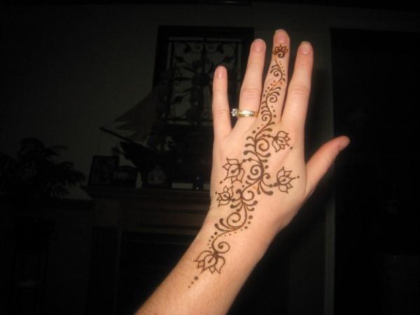 Attractive Henna Flowers Tattoo On Left Hand