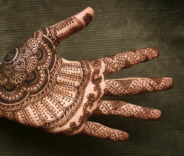 Attractive Henna Tattoo On Left Hand Palm